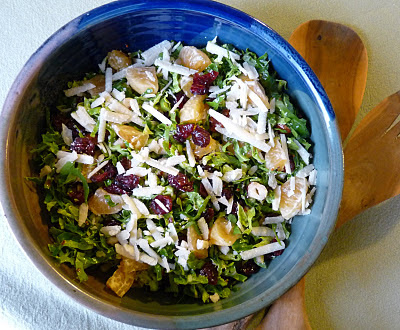 Brussels Sprouts Salad with Dried Cranberries Hazelnuts and Cheese