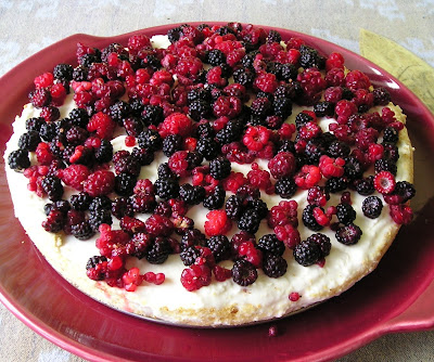 Unbaked Whipped Cream Cheese Cake Topped with Berries Unbaked Whipped Cream Cheese Cake Topped with Berries