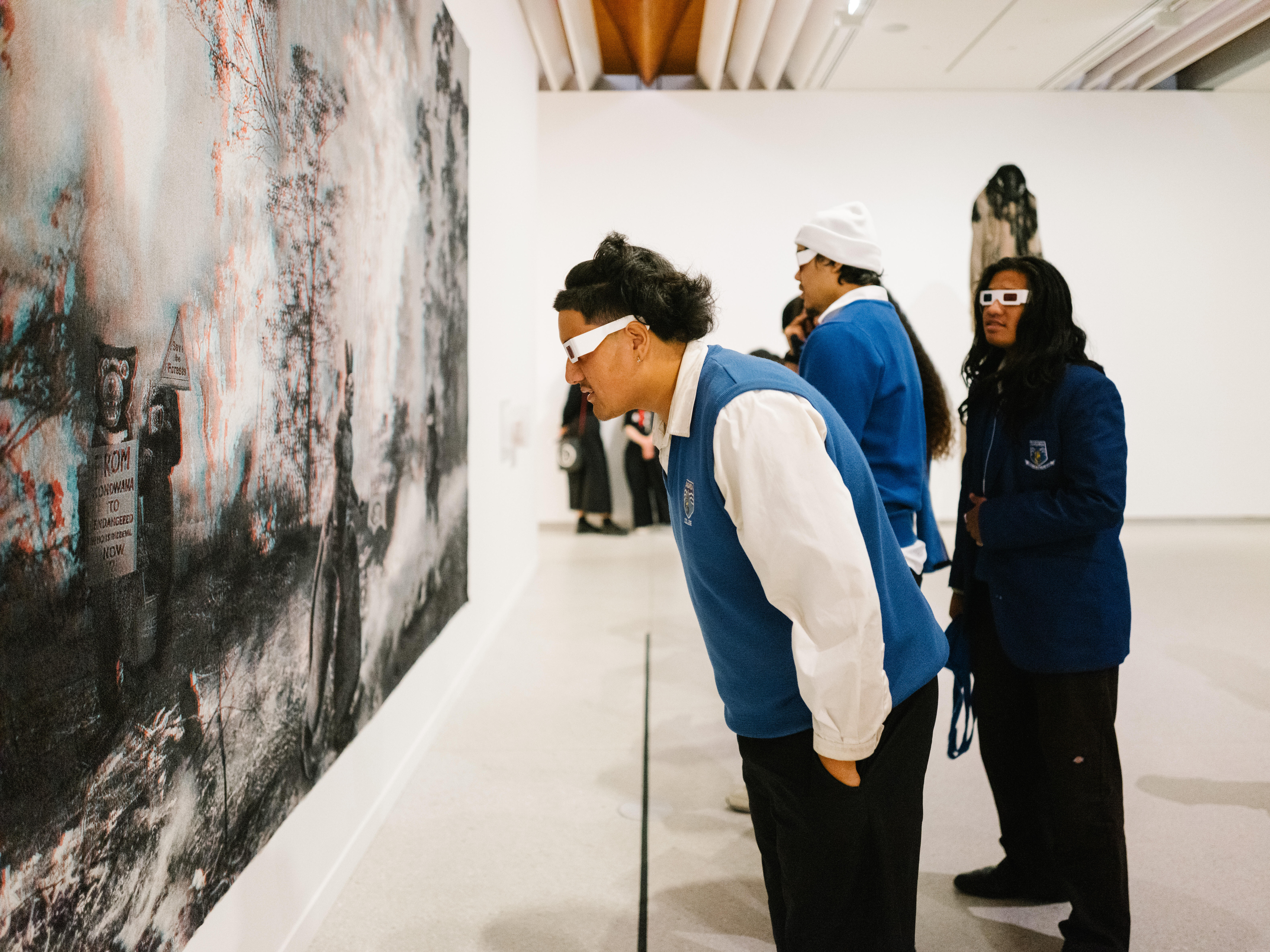 <p>Students exploring exhibitions, 2024</p>
