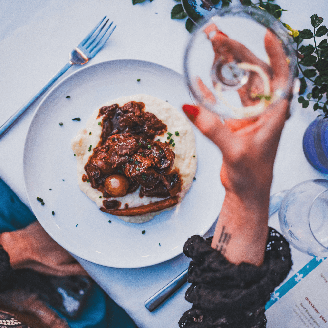 Image of a plate and cheers - catering event San Diego.