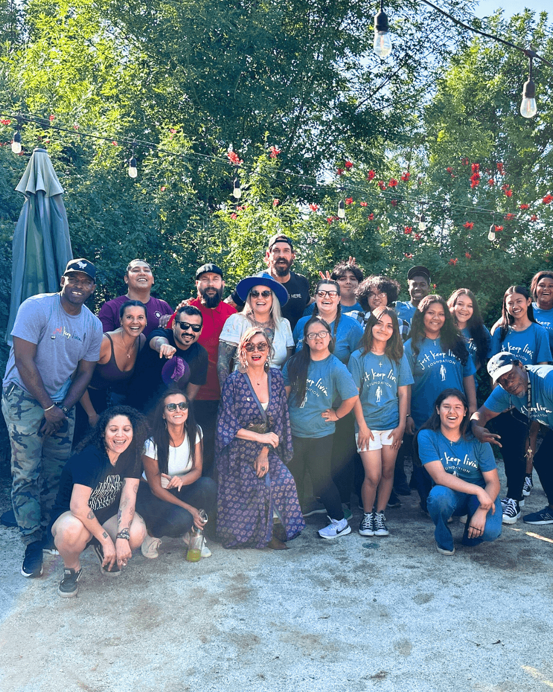 Group photo of the JKL Foundation team with Camila and Matthew McConaughey at Victoria Ranch during their Morse High School student event, hosted by Chef Joann Catering