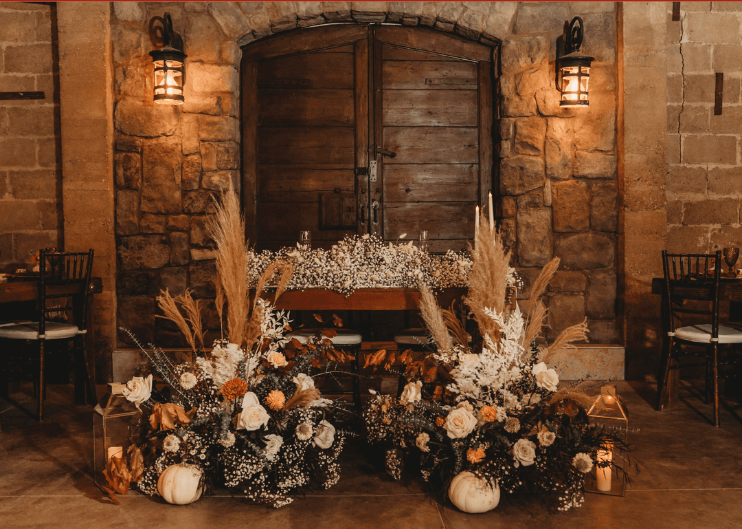 Rustic-chic barrel room at Forgotten Barrel Winery in Temecula, featuring stacked oak barrels under warm Edison bulb lighting—an elegant wine country venue for Chef Joann Catering's curated dinners and events.