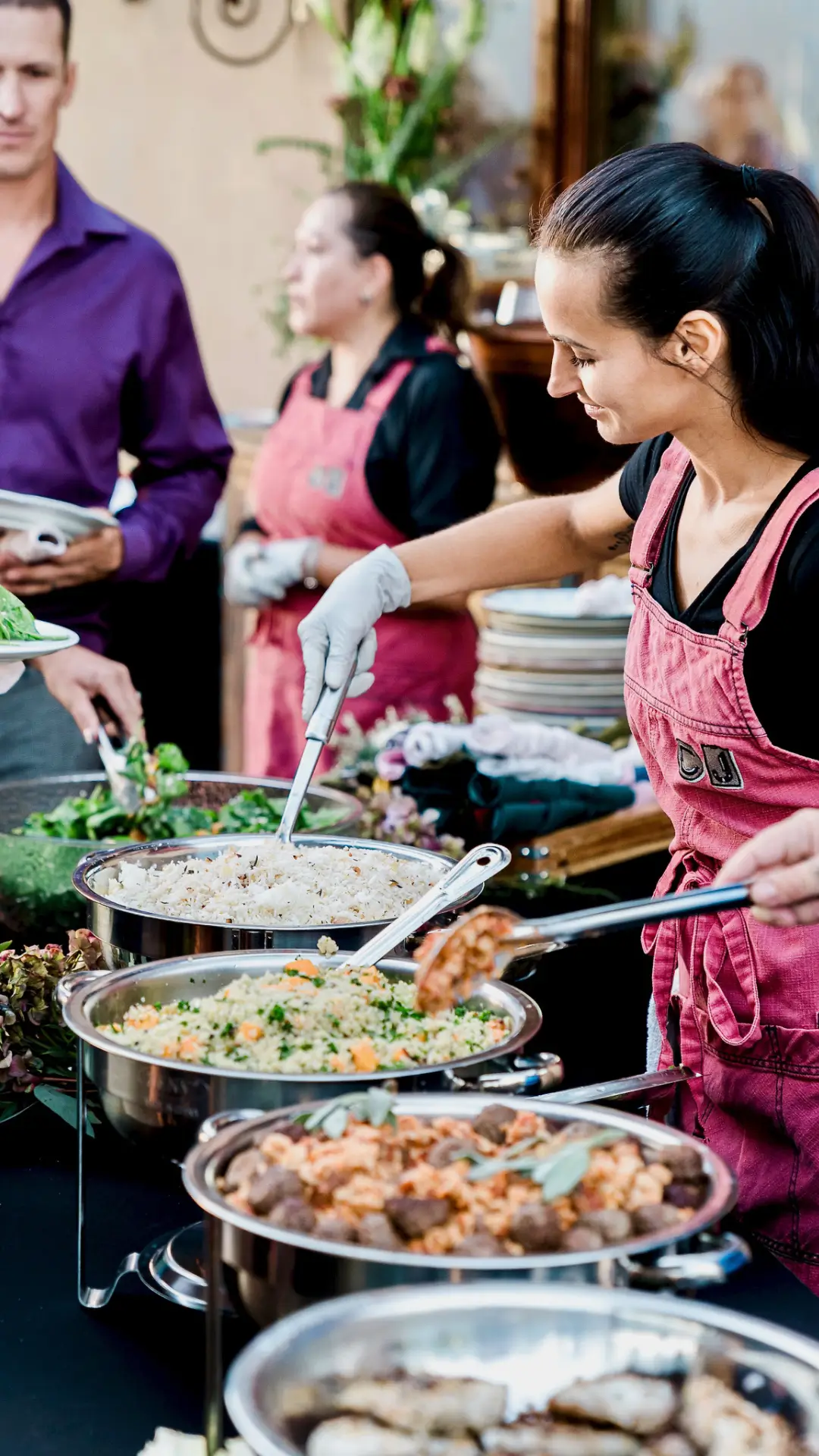 Palm Springs wedding buffet expertly curated by Chef Joann Catering, with attendant serving gourmet dishes