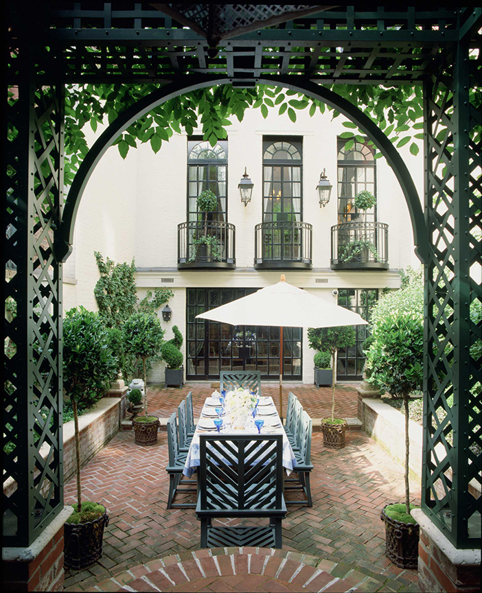 Garden with set table and umbrella