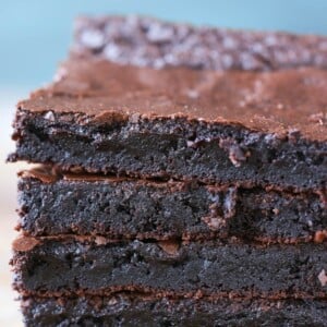 One Bowl Brownie Sideview Light Blue Backdrop Easy Chocolate Desserts.