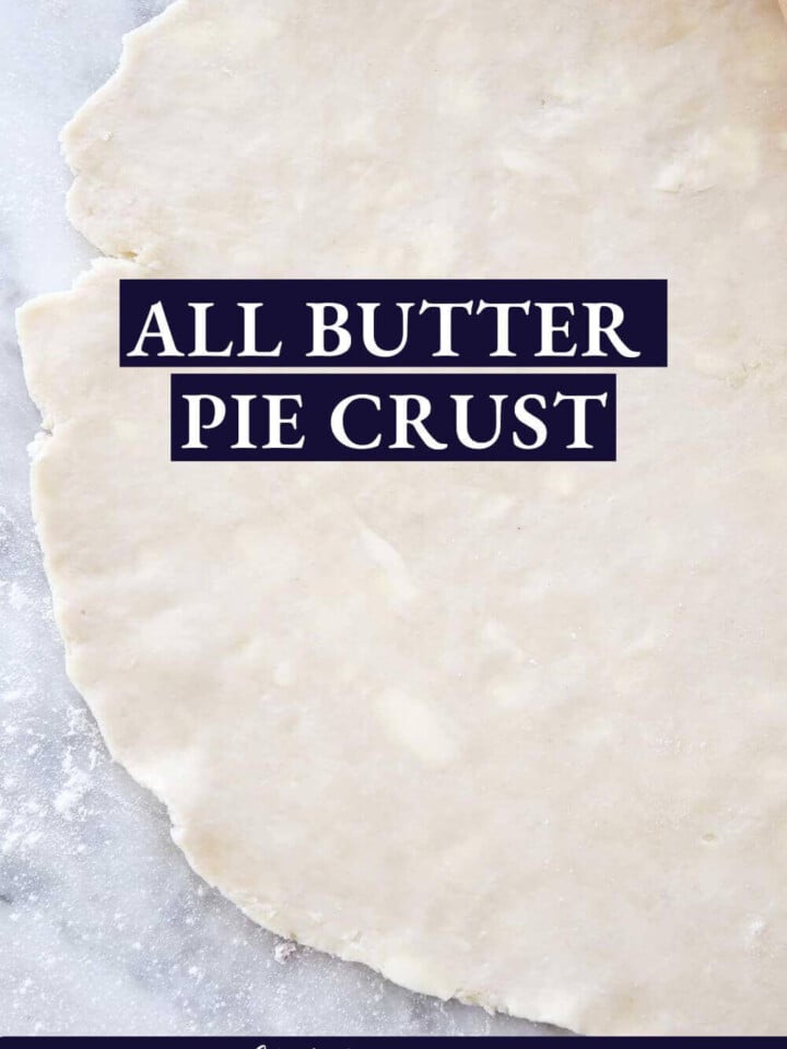 pie dough rolled out thin on marble.