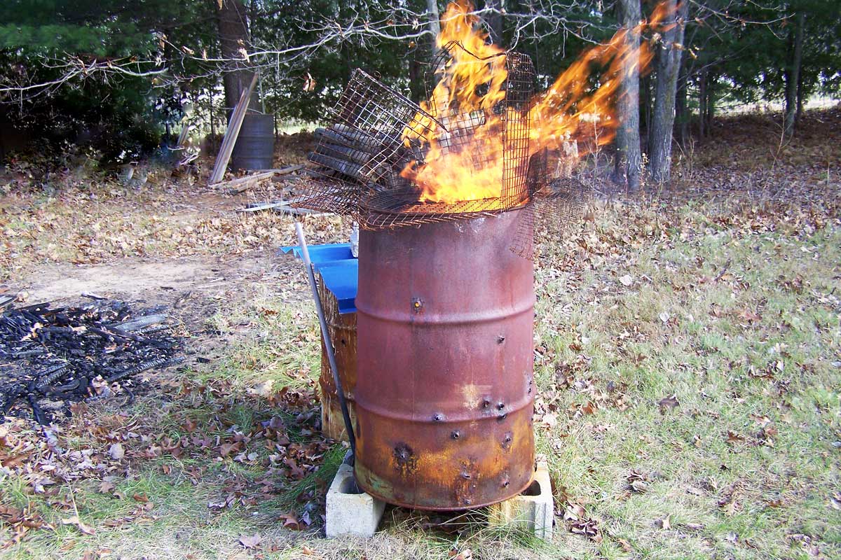 DIY burn barrel with fire burning