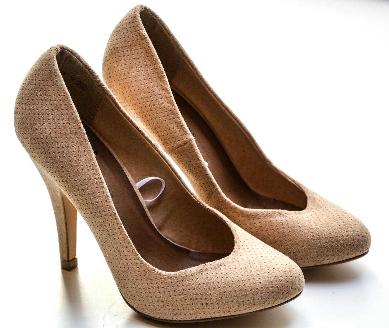 Home Stylish beige stiletto high heels with a textured leather design, perfect for fashion-forward elegance.