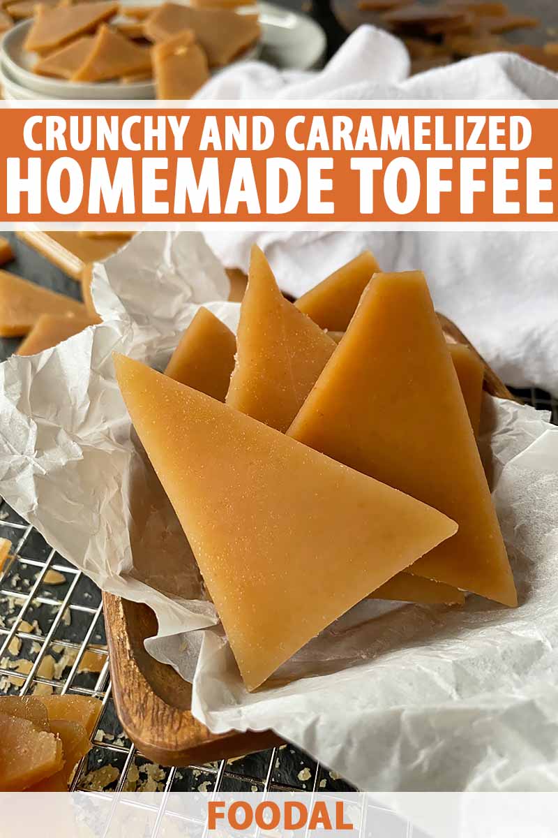 Vertical image of a wooden bowl lined with parchment paper filled with pieces of caramel candy on a cooling rack, with text on the top and bottom of the image.