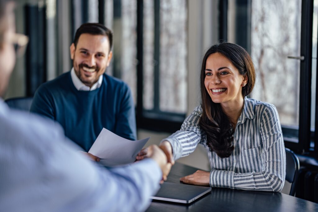 Elderly couple going over finances with laptop