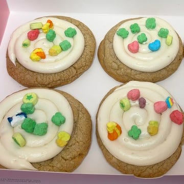 box containing decorated cookies with frosting and colorful toppings box containing decorated cookies with frosting and colorful toppings
