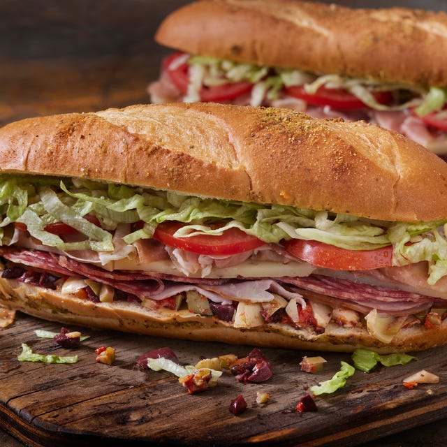 Muffuletta, Italian Sandwich with Olive , Roasted Peppers and Artichoke Spread Muffuletta, Italian Sandwich with Olive , Roasted Peppers and Artichoke Spread