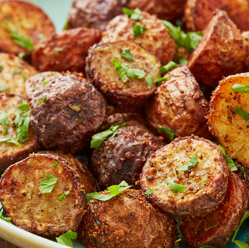 Air Fryer Potatoes air fryer potatoes topped with herbs