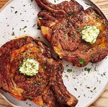 Air Fryer Steak steak on a plate with butter and herbs