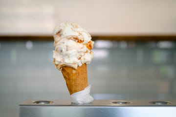 an ice cream cone is sold in a cafe, in a chain of fast food restaurants vegan or vegetarian ice cream vanilla sherbet, dessert the concept of rest and relaxation, vacations dependence on sweets