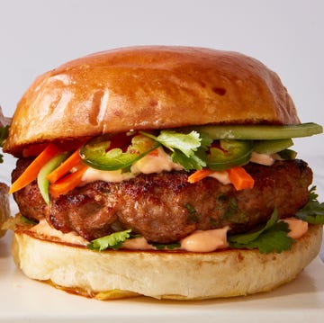 Banh Mi turkey burger turkey burger topped with banh mi toppings like pickled carrots, jalapenos, and sriracha mayo