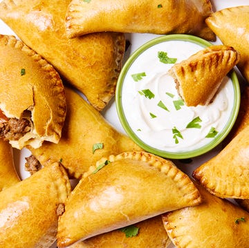 Beef Empanadas golden brown beef filled empanadas with a creamy dipping sauce