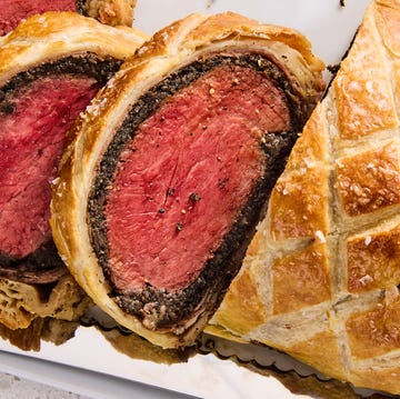 Beef Wellington beef wellington sliced with fresh rosemary