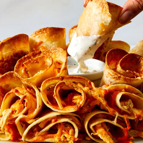 Blooming Quesadilla Ring many quesadillas folded and placed into a ring shape that surrounds a cup of dip