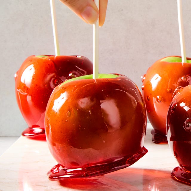 Candy Apples green apples with a red candy coating and a popsicle stick