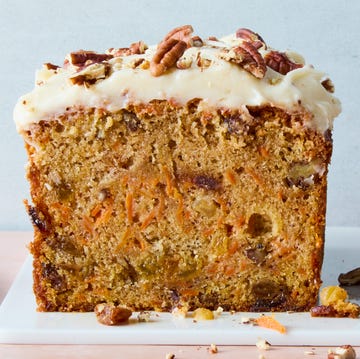 Carrot Cake Bread carrot cake loaf with cream cheese frosting and chopped nuts