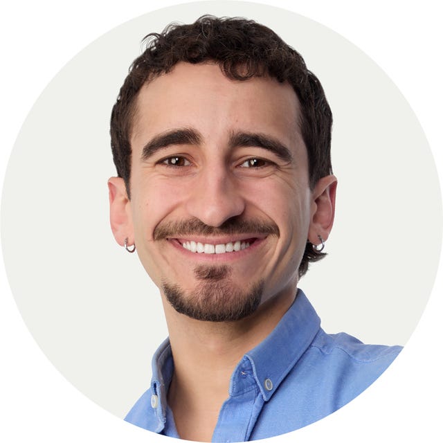 Circular portrait of a person with obscured facial features wearing a blue shirt.