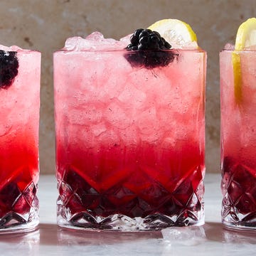 Classic Bramble classic bramble cocktail in a cup with ice with a lemon garnish