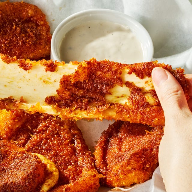 Copycat Chili's Nashville Hot Mozzarella Sticks mozzarella sticks covered in hot sauce