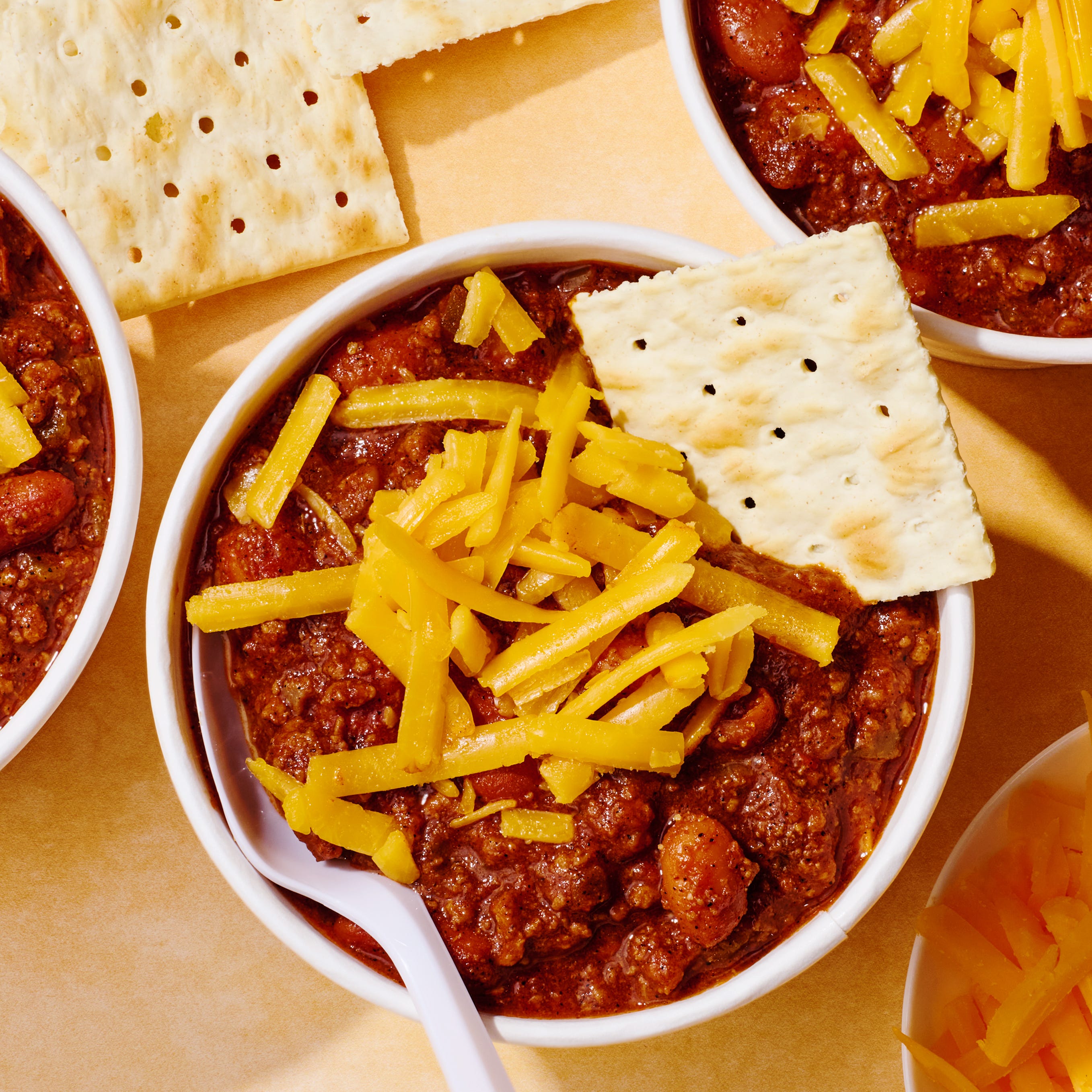 copycat wendy's chili topped with cheese and saltines