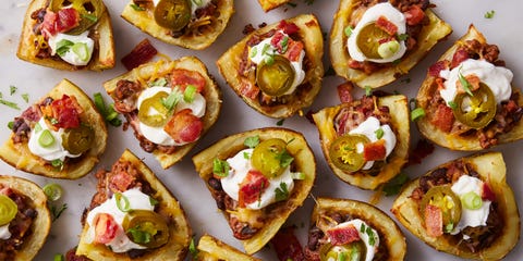Cowboy Potato Skins potato skins topped with chili, sour cream, jalapenos, and bacon