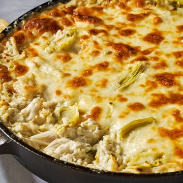 Crab Artichoke Dip crab and artichokes in a cheesy baked dip in a cast iron dip served with toasted bread