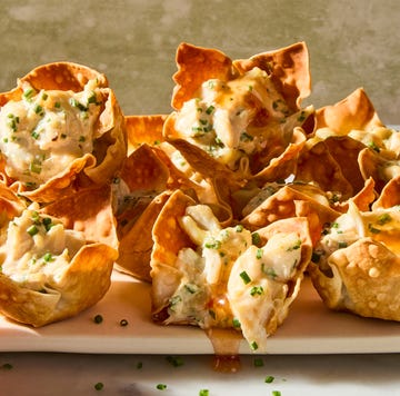 Crab Rangoon Wonton Cups crispy baked wonton cups filled with tangy cream cheese, jumbo lump crab, grated garlic, and chives served with a sweet and sour sauce