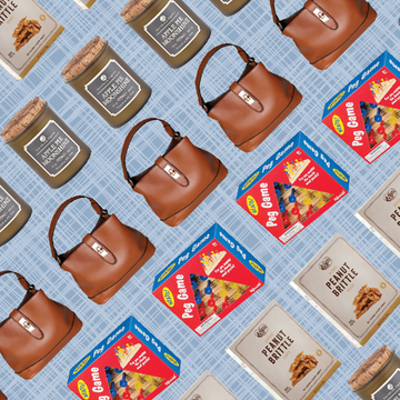 cracker barrel blue background with items sold by cracker barrel such as a candle, brown purse, peanut brittle, and a peg game