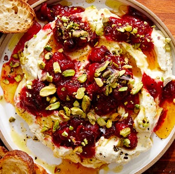 Cranberry Whipped Feta Dip whipped feta topped with cranberry sauce, chopped pistachios, and honey