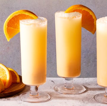 Creamsicle Mimosas creamsicle mimosas filled with ice and garnished with an orange wedge