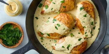 chicken breasts topped with a creamy dijon mustard sauce and fresh herbs
