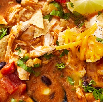 Crock-Pot Chicken Enchilada Soup crockpot chicken enchilada soup topped with cheese, sour cream, and crushed chips