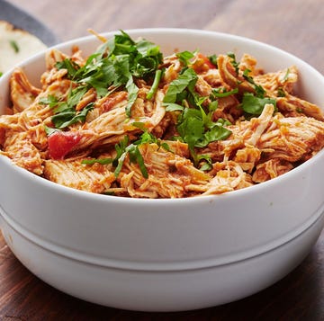 Crockpot Salsa Chicken salsa chicken in a bowl topped with cilantro