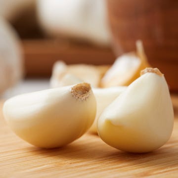 Close up on a Clove of Garlic and Garlic bulbs Close up on a Clove of Garlic and Garlic bulbs