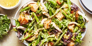 Spring chicken panzanella salad spring chicken panzanella salad topped with asparagus, peas, and shredded chicken