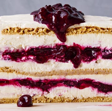 Blueberry cheesecake icebox cake blueberry cheesecake icebox cake with layers of graham crackers, whipped cheesecake, and blueberry jam on a marble slab