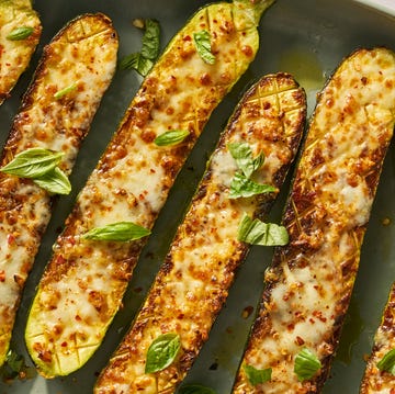 Cheesy garlic zucchini steaks cheesy garlic zucchini steaks on a greek plate topped with basil and red pepper flakes