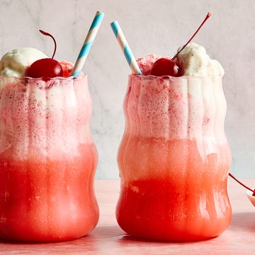 Shirley Temple Float bubbly ginger ale, sweet grenadine, and creamy vanilla ice cream with a maraschino cherry