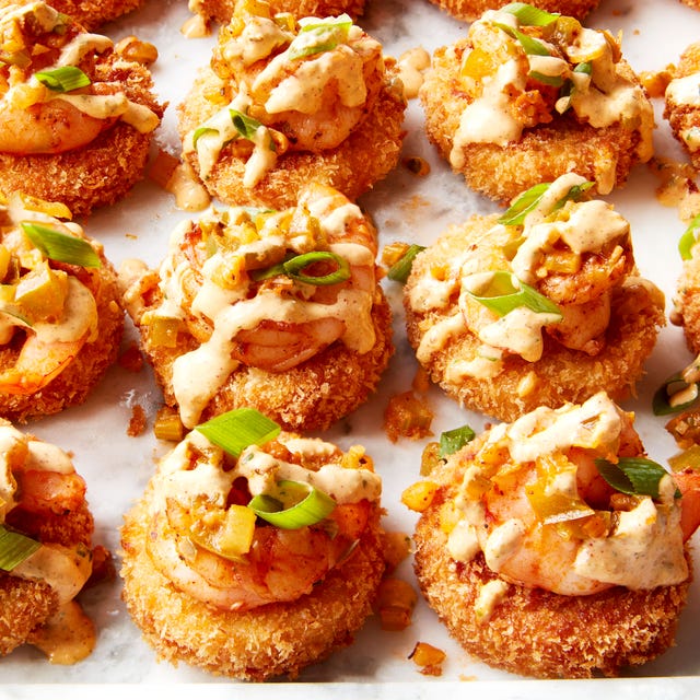 Cheesy Shrimp & Grit Bites smoked gouda grits, breaded and fried until crispy then topped with cajun seasoned shrimp and creamy remoulade sauce