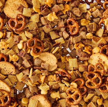 Chex Mix a bowl of homemade chex mix with pretzels, chex cereal, goldfish, and bagel chips