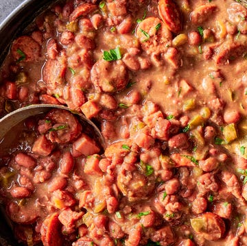 Red Beans and Rice a creole classic with tender, creamy red beans stewed in smoked ham and andouille sausage and flavored with holy trinity vegetables, then served over steamed rice