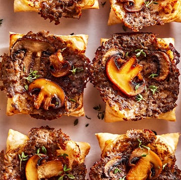 Upside-Down Cream Of Mushroom Tarts individual puff pastry squares topped with a cheesy mushroom duxelles, slices of roasted mushrooms, and fresh thyme