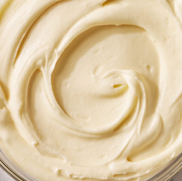 Cream cheese frosting cream cheese frosting in a bowl with a spoon