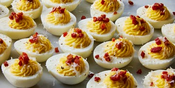 carbonara deviled eggs topped with pecorino romano and crispy pancetta
