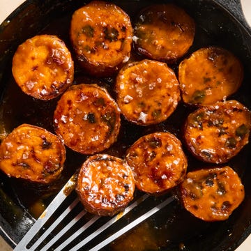 Melting sweet potatoes melting sweet potatoes in a cast iron skillet topped with miso maple butter glaze and flaky salt